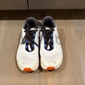 On Running Athletic Shoes in White and Orange